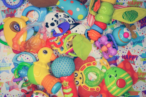Children's toys on a multi-colored background — Stock Photo, Image