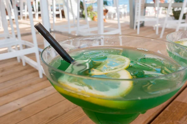 Beautiful green cocktail in a summer cafe
