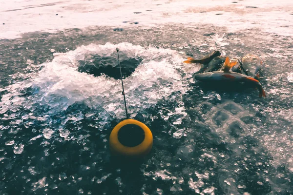 Ice fishing on the lake — Stock Photo, Image