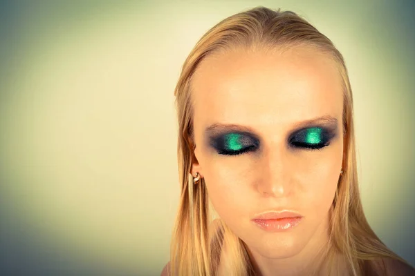 Makeup with green shadows