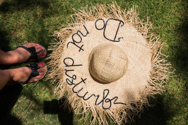 Straw hat on the background of the sea