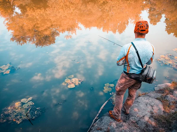 Young man fishing. bokeh , blurred background — Stock Photo, Image