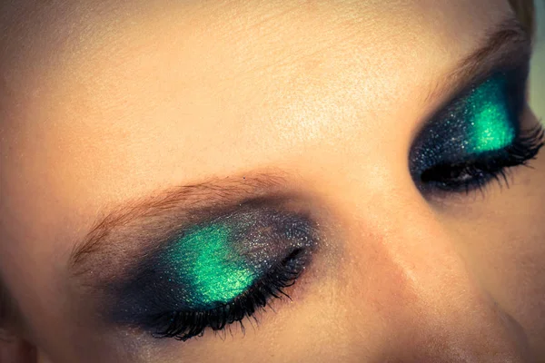 Makeup with green shadows