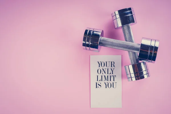 Sports concept: dumbbells on a pink background — Stock Photo, Image