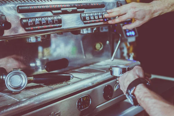 Barman prepares coffee in a coffee machine — Stock Photo, Image