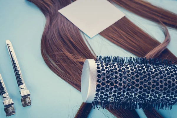 Hairdresser concept: false hair and hairpins — Stock Photo, Image