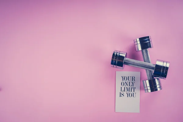 Sports concept: dumbbells on a pink background — Stock Photo, Image