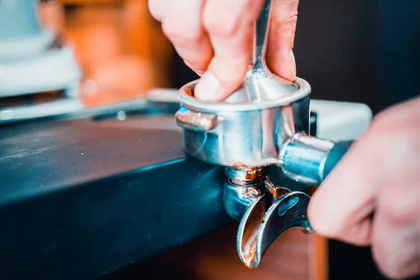 Barman prepares coffee in a coffee machine — Stock Photo, Image