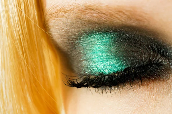 Eye makeup with green shadows