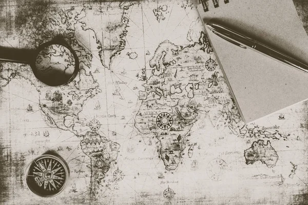 An ancient map, a compass and a magnifying glass — Stock Photo, Image