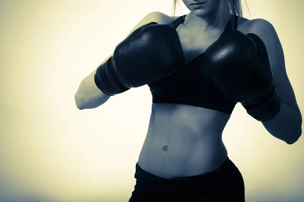 Girl in boxing gloves at the studio — Stock Photo, Image