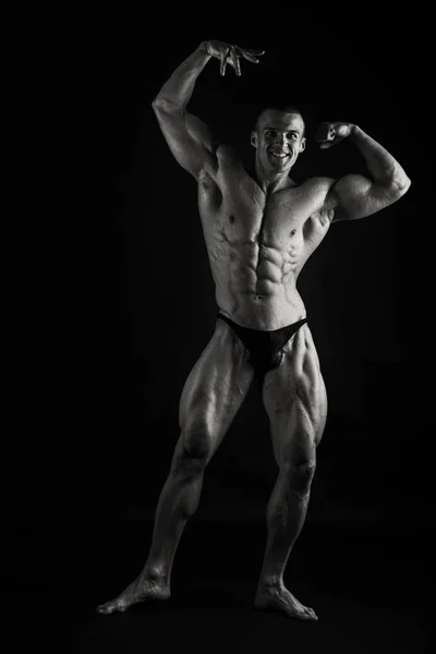 Bodybuilder showing his back and biceps muscles, personal fitnes — Stock Photo, Image