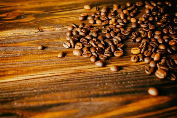 Kaffeebohnen auf dem Tisch Hintergrund — Stockfoto