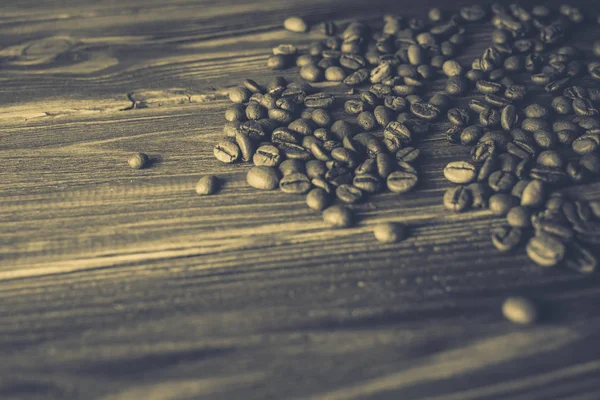 Kaffeebohnen auf dem Tisch Hintergrund — Stockfoto