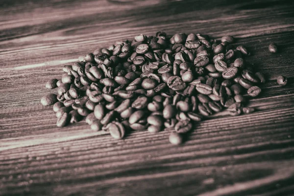 Kaffeebohnen auf dem Tisch Hintergrund — Stockfoto