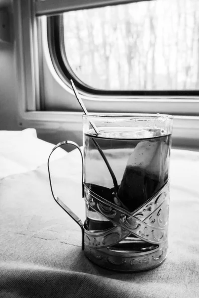 Tea in a glass beaker on a train