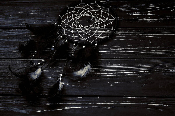 Dream catcher on wooden background