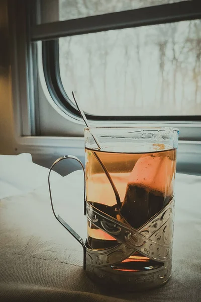 Tea in a glass beaker on a train