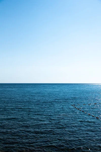 Fénykép lapos tengeri horizont, nap — Stock Fotó