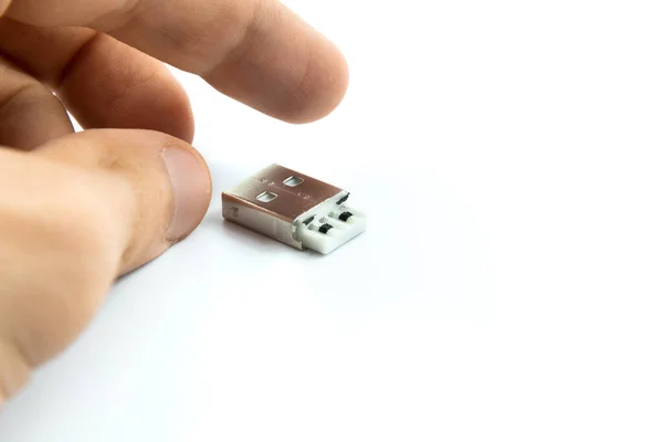 A white USB type C charger cable, compatible for many devices, wrapped in a spiral shape, isolated on white background.