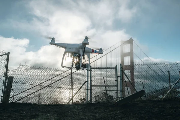 drone take off over golden gate bridge fly to bay bridge San Francisco CA USA