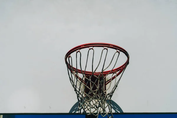 in basketball, the basketball court is the playing surface, consisting of a rectangular floor with baskets at either end.