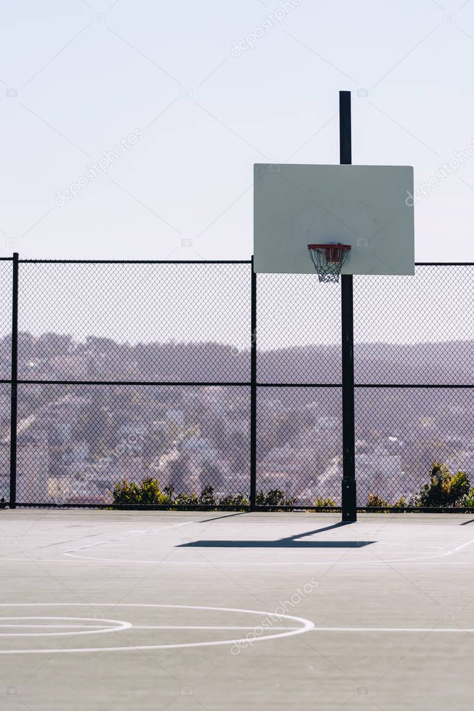in basketball, the basketball court is the playing surface, consisting of a rectangular floor with baskets at either end.
