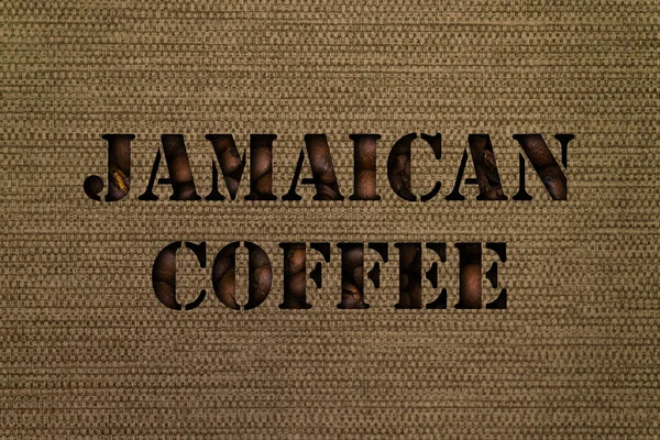 Разновидности ямайского кофе текст из кофейных зерен на фоне холста ткани — стоковое фото