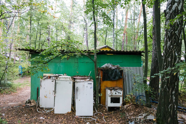 Several refrigerators scrap metal, household . Damaging the planet's ecology with garbage