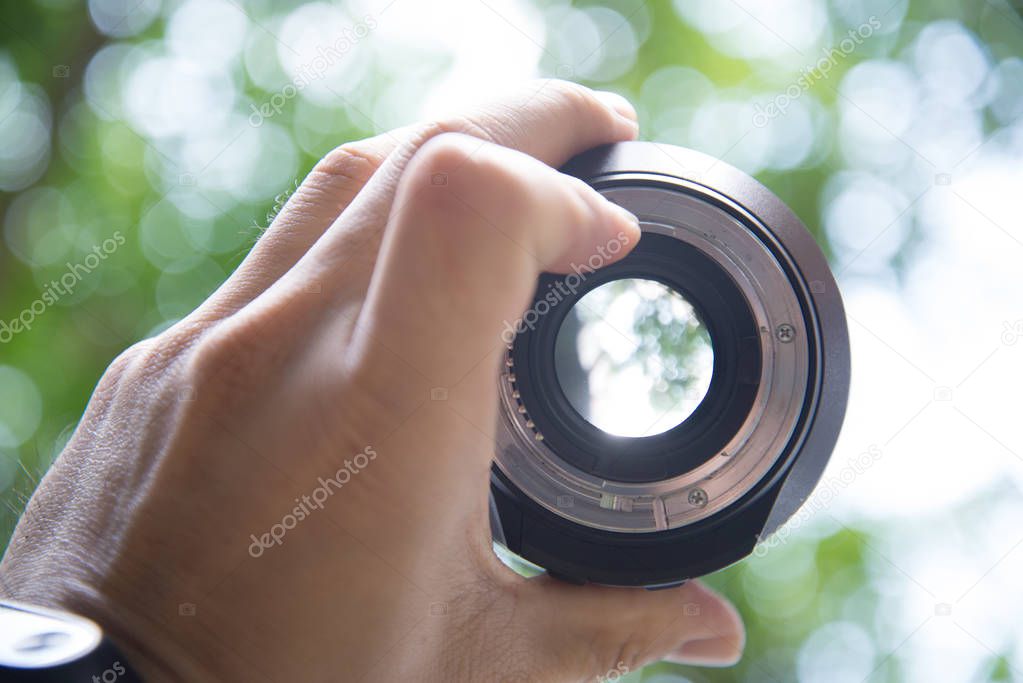 Aperture of the lens and the bokeh background of the tree