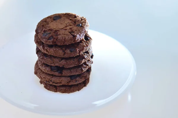 Chocolate biscuits plus raisins, round in shape with a rough tex — Stock Photo, Image