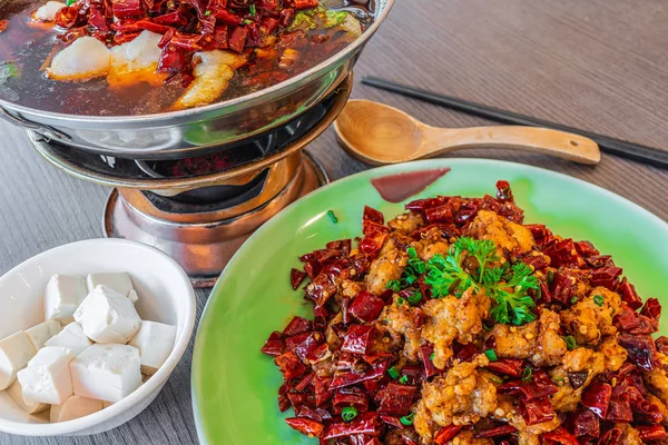 Asia, China food. Szechuan water boiled spicy fresh fish. Fried Chicken side dish.