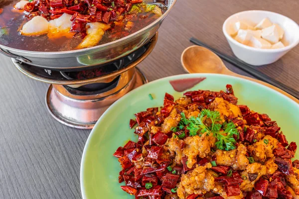 Asia, China food. Szechuan water boiled spicy fresh fish. Fried Chicken side dish. Chongqing Chengdu food.