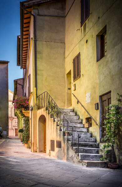 Beautiful street of tuscan Pienza town in the evening
