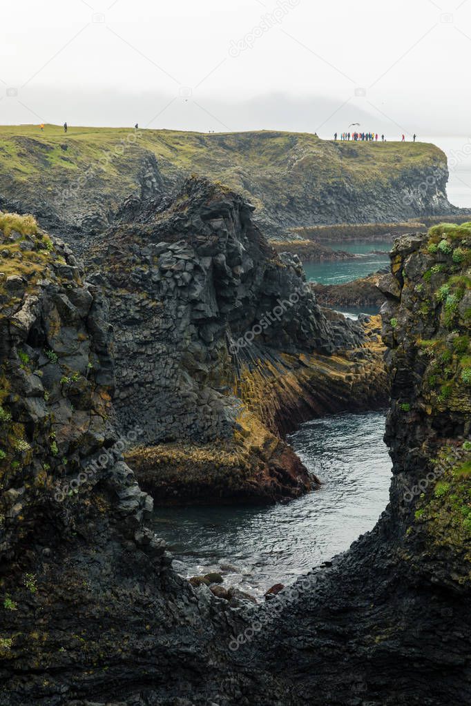 View at the cliffs on the seaside near the Gatklettur - Arch Rock in Iceland
