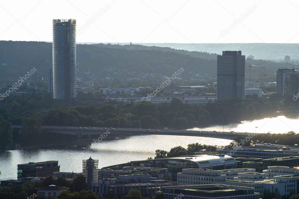 View over Bonn from the Ennert hills, a sunset is refecting in the river Rhine.