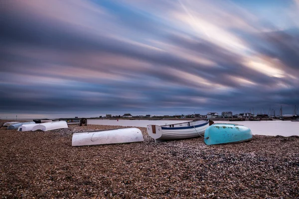 Up turned row boats on a stoney beach — Stock Photo, Image