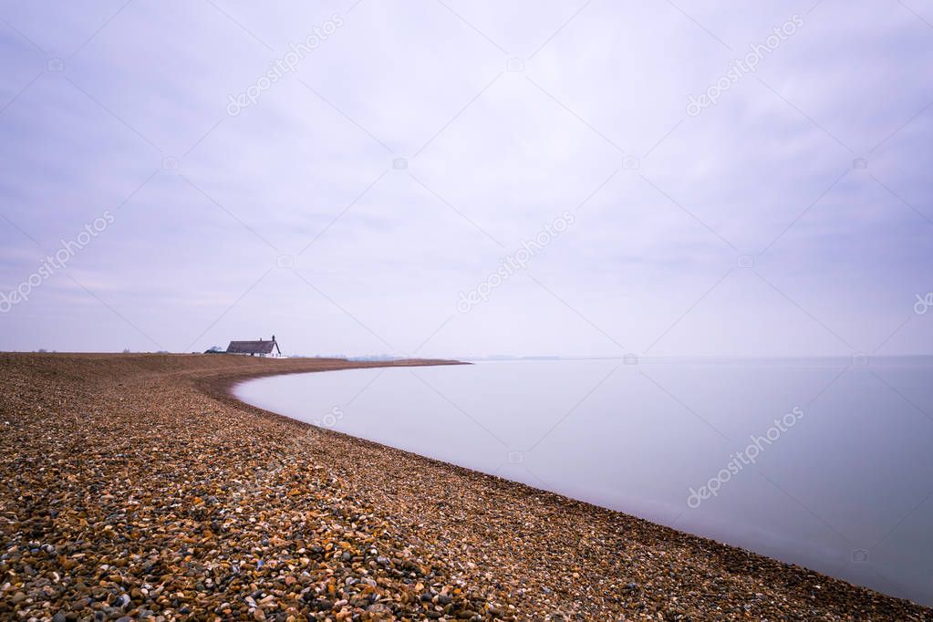 A long exposure of the clouds and water at Shingle Street in Suffolk