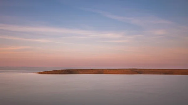 A long exposure of the clouds and water at Shingle Street in Suffolk — Stock Photo, Image
