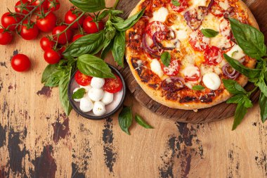 Homemade Pizza Margarita with Tomatoes, Basil and Mozzarella Cheese