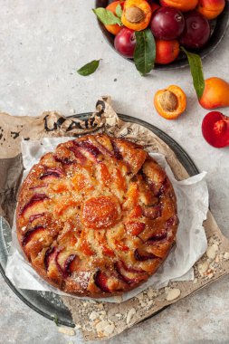Summer apricot and plum pie. Top view