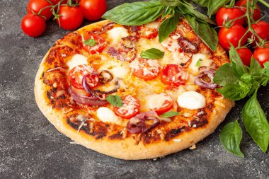 Homemade Pizza Margarita with Tomatoes, Basil and Mozzarella Cheese