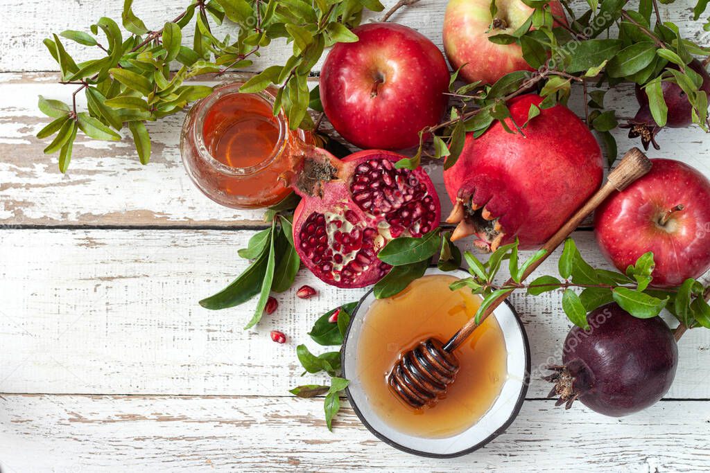 Rosh hashanah, jewish New Year holiday concept. Taditional symbols, apples, pomegranate, honey.