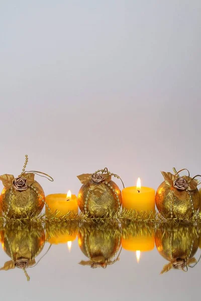 Golden Christmas balls and candlelight. Place for text — Stock Photo, Image