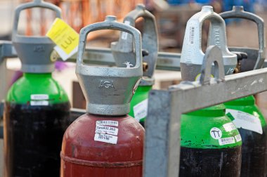 Umea, Norrland Sweden - April 8, 2020: different types of gas bottles for welding and construction