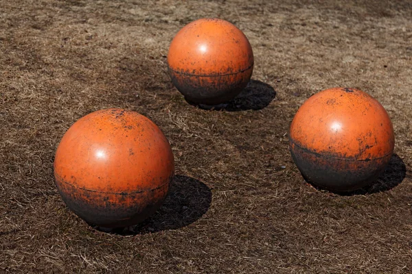 three orange balls at the playground at Haga