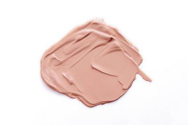 Beyaz arka planda Sıvı Vakfı lekesi. Kozmetik Makyaj Kremi Örnekleri Beyazda İzole Edildi.