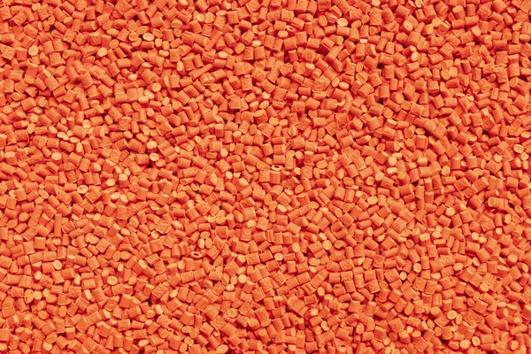 Resina Plastica Arancione Masterbatch Uno Sfondo — Foto Stock