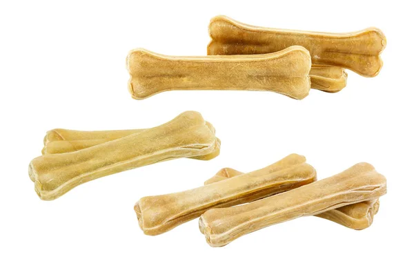 Jeu de bâtons d'os de cuir brut pour chiens isolés sur fond blanc — Photo