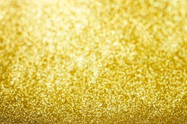 Soyut altın parıltılı arka plan. Işıltı altın bokeh noel arka plan. 